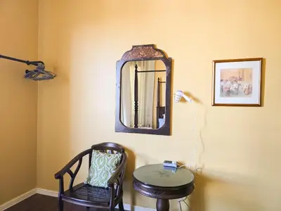 a room with a table and a mirror and a chair at Mossy Forest Family Retreat V, Kea Farm, 2-8 guests, Keafarm, Cameron Highlands in Cameron Highlands