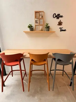a table and two chairs in a room at TwinTree Kelawai in George Town