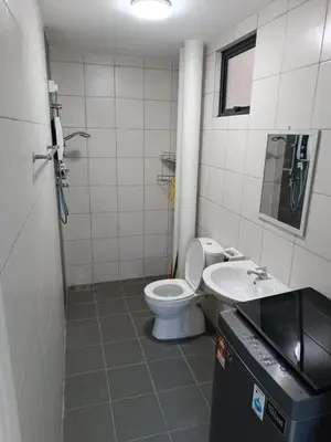a bathroom with a toilet and a sink at The Sun condo at taman sri nibong ,near queenbaymall in Bayan Lepas