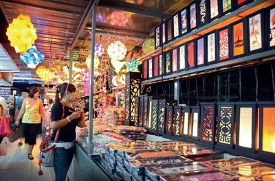 a woman standing in front of a book store at Georgetown Homestay in George Town