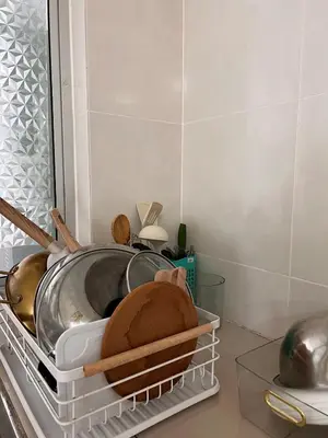 a kitchen with a pot and a pan on a shelf at Lily Dante in Tanah Rata