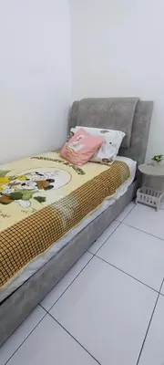 a bed sitting on the floor in a room at HEE & PENNIE House in Ipoh