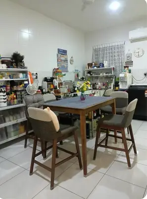 a table and two chairs in a kitchen at HEE & PENNIE House in Ipoh