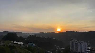 a view of the sun setting over a city at Palas Horizon Kea Farm 2-9 pax 180 View Cameron in Brinchang