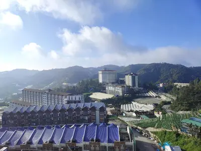 an overhead view of a city with buildings and mountains at Palas Horizon Kea Farm 2-9 pax 180 View Cameron in Brinchang