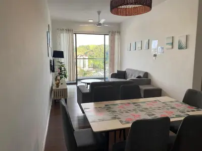 a living room with a table and chairs and a couch at Palas Horizon Kea Farm 2-9 pax 180 View Cameron in Brinchang