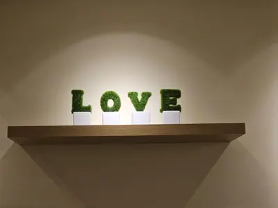 a shelf with the word love spelled out at CozyHome - 3 bedroom Town House with unlimited free Wi-Fi in Sitiawan