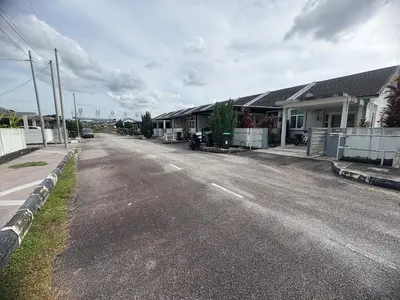 an empty street in a residential neighborhood with houses at HoMestaY Kulim Seri Rambai in Kulim