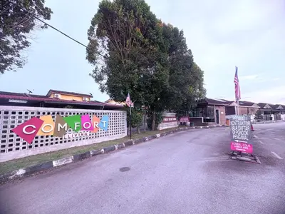 an empty street with a sign on a fence at HoMestaY Kulim Seri Rambai in Kulim