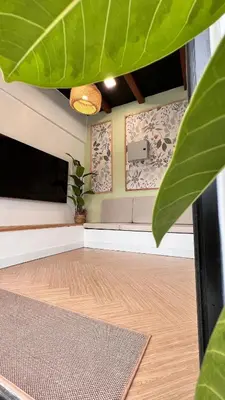 a living room with a couch and a tv at Dahlia Kulim Pool Homestay in Kulim