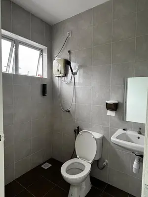 a bathroom with a toilet and a sink at \u73ed\u53f0212\u6c11\u5bbf Pantai Remis in Pantai Remis