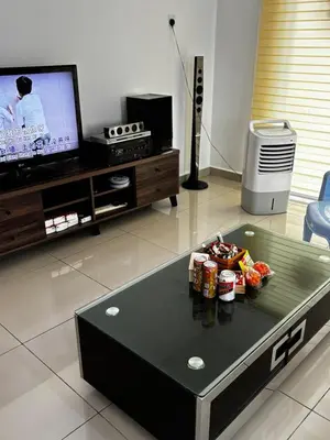a living room with a table with food on it at \u73ed\u53f0212\u6c11\u5bbf Pantai Remis in Pantai Remis