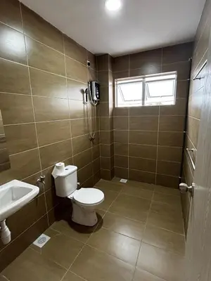 a bathroom with a toilet and a sink at \u73ed\u53f0212\u6c11\u5bbf Pantai Remis in Pantai Remis