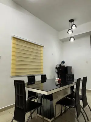 a room with a table with chairs and a window at \u73ed\u53f0212\u6c11\u5bbf Pantai Remis in Pantai Remis