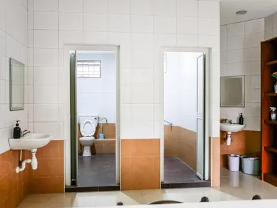 a bathroom with a toilet and a sink at Wishful Guesthouse at Georgetown#LohGuanLye#BudgetStay in George Town