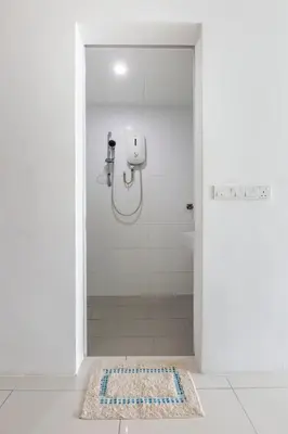 a shower stall in a bathroom with a shower at Cozy Seaview Duplex Apartment at Sunrise Gurney in George Town