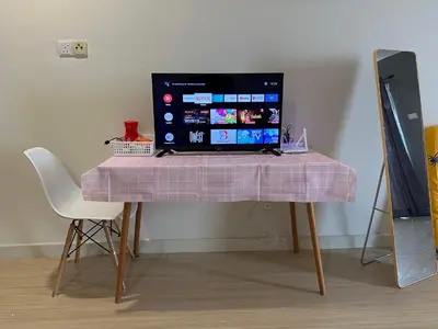 a table with a laptop computer on top of it at High Floor Naz Comfort Suite Champs Elysees in Kampar