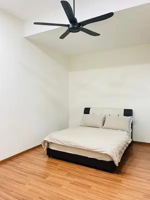 a bed in a room with a ceiling fan at Sofea Homestay Ipoh V2 in Ipoh