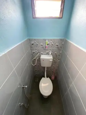 a small bathroom with a toilet and a window at Nabilah Homestay Labuh Banting in Kepala Batas