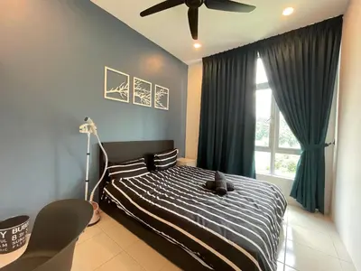 a bedroom with a bed and a ceiling fan at The Anderson Residence Ipoh#1018 in Ipoh