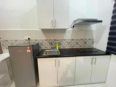 a small kitchen with a sink and a refrigerator at The Anderson Residence Ipoh#1018 in Ipoh
