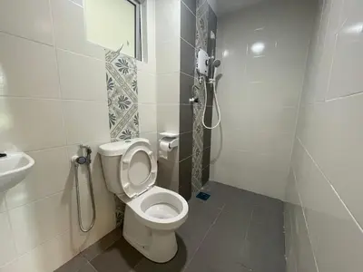 a bathroom with a toilet and a sink at The Anderson Residence Ipoh#1018 in Ipoh