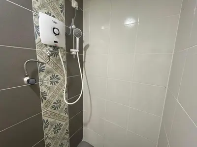 a shower with a shower head in a bathroom at The Anderson Residence Ipoh#1018 in Ipoh