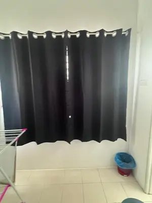 a black shower curtain in a room with at AYAAN COZY PRIMA HOMESTAY FREE WiFi in Tanah Rata