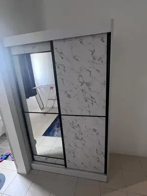 a glass door with marble panels in a room at AYAAN COZY PRIMA HOMESTAY FREE WiFi in Tanah Rata