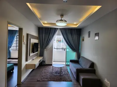 a living room with a couch and a table at AYAAN COMFY PRIMA HOMESTAY FREE WiFi in Tanah Rata