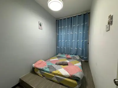 a small bedroom with a bed in the corner at AYAAN COMFY PRIMA HOMESTAY FREE WiFi in Tanah Rata