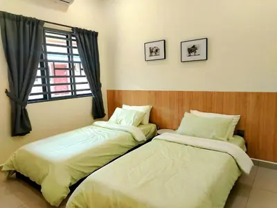 two beds sitting next to each other in a room at Mootopia BM homestay room rent in Bukit Mertajam