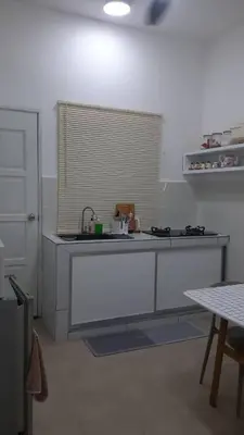a kitchen with a sink and a counter top at The SAFYYA House Teluk Senangin in Lumut