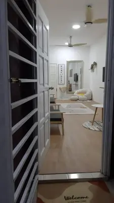 a view of a living room through a door at The SAFYYA House Teluk Senangin in Lumut