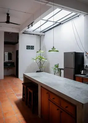 a kitchen with a large counter in a room at Aayu Heritage - Heritage Home in Stewart Lane in George Town