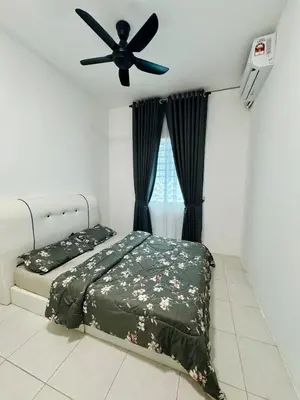 a bedroom with two beds and a ceiling fan at Zalins CozyHome 3BR - Double Storey Terrace in Kepala Batas