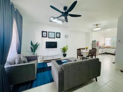 a living room with two couches and a ceiling fan at Zalins CozyHome 3BR - Double Storey Terrace in Kepala Batas