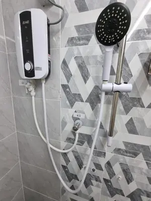 a hair dryer is attached to a wall in a bathroom at Vacation Ipoh Homestay for 12 Pax 4 Bedrooms for Delicious Food in Ipoh