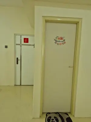 a room with a door with a sign on it at Vacation Ipoh Homestay for 12 Pax 4 Bedrooms for Delicious Food in Ipoh