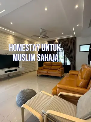 a living room with two couches and a television at Adik Aisyah cameron semi-D goleden hill homestay in Brinchang