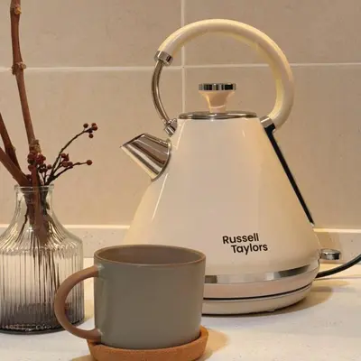 a tea kettle and a cup on a counter at The Heritage 3BR Apartment at Town Centre in Ipoh