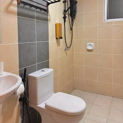 a bathroom with a toilet and a sink at The Heritage 3BR Apartment at Town Centre in Ipoh