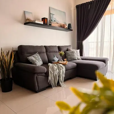 a living room with a couch and a table at The Bay 6pax 2BR Apartment at Town Centre in Ipoh