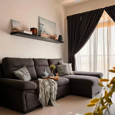 a living room with a couch and a window at The Bay 6pax 2BR Apartment at Town Centre in Ipoh