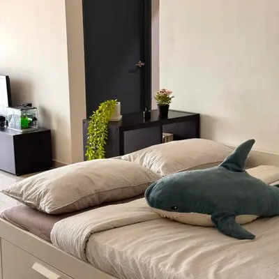 a shark pillow sitting on top of a bed at The Bay 6pax 2BR Apartment at Town Centre in Ipoh