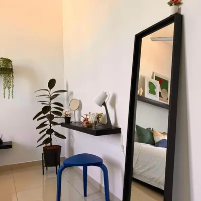 a mirror and a blue stool in a room at The Bay 6pax 2BR Apartment at Town Centre in Ipoh