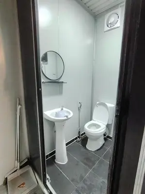 a bathroom with a toilet and a sink at ZR Homestay in TanjongMalim