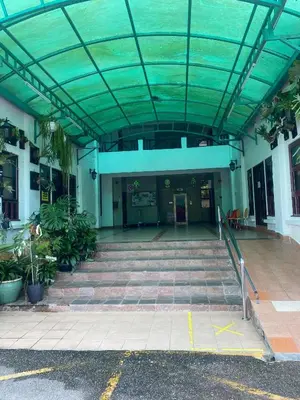 a large building with a glass ceiling and stairs at Highlanders Apartment in Tanah Rata