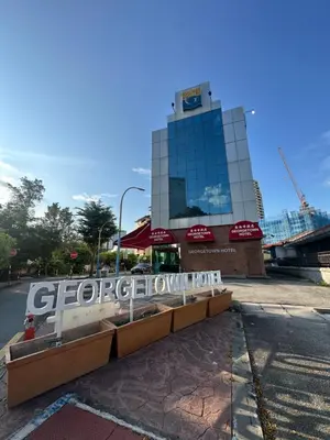 a building with a sign in front of it at Georgetown Hotel in George Town