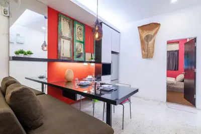 a living room with a table and a couch at Unique Design House, 2BR House - Near Ipoh Local Foodies in Ipoh